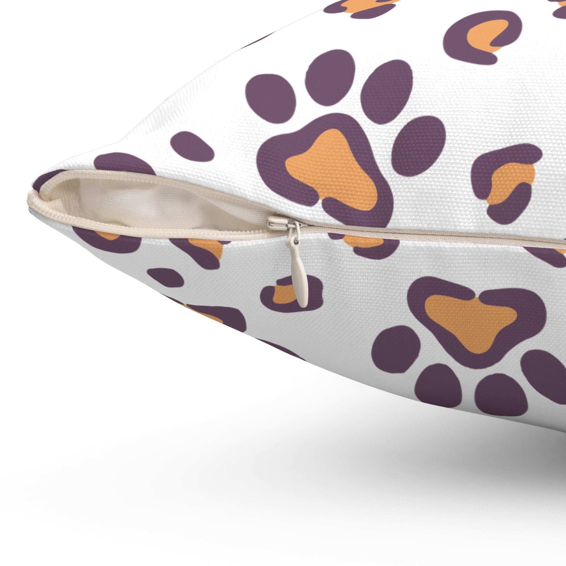 Dog Lovers Pillow white decorative throw pillow with purple and orange paw print pattern and zipper detail