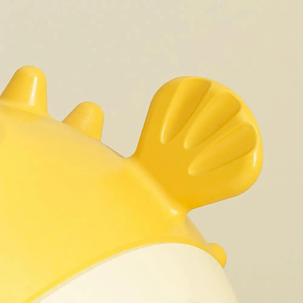 Wefulfil fish shaped dog chew toy close up showing yellow rubber fin and textured playful design