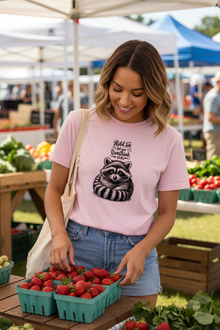 Person wearing Overthinking Racoon t-shirt at farmers market