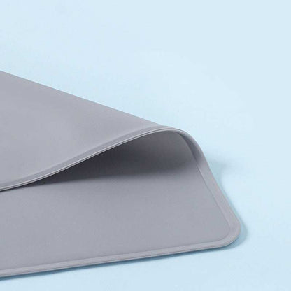 Silicone Pet Feeding Mat in grey designed to keep floors clean while pets eat