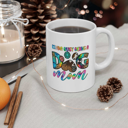 Pet Owner Coffee Cup white ceramic mug with colorful Dog Mom design filled with coffee on cozy holiday table