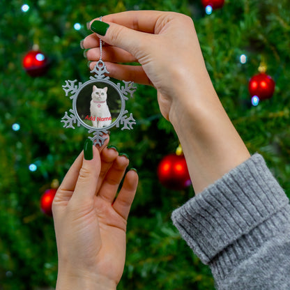Snowflake Pet Ornament showing personalized round photo of a white cat held by hands in front of decorated Christmas tree