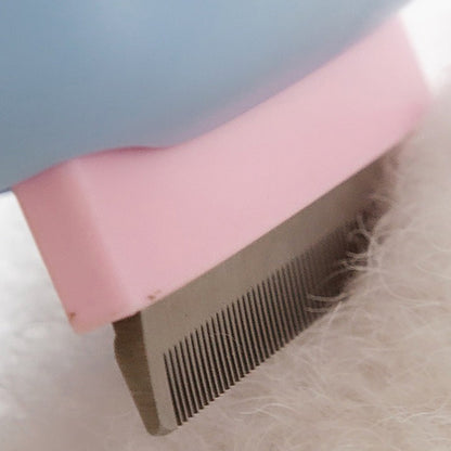 Wefulfil pet deshedding brush for dogs and cats closeup showing stainless steel teeth removing white fur