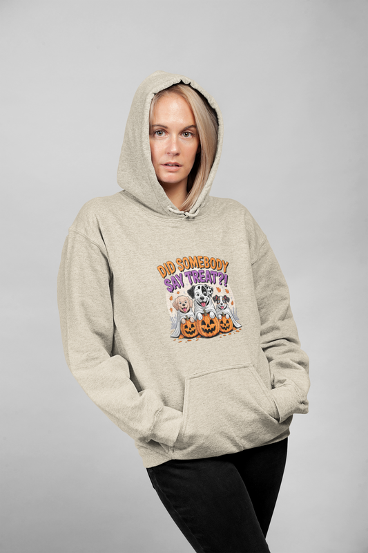 Woman modeling Printify beige hoodie featuring three dogs with pumpkins graphic titled Halloween Dog Sweatshirt