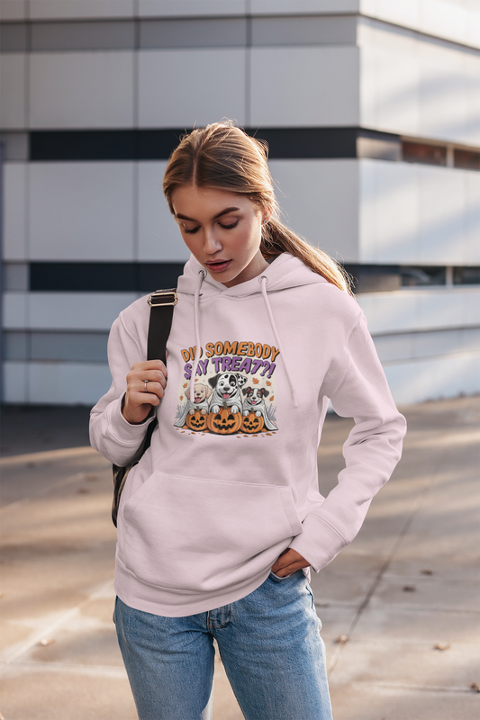 Woman wearing light pink hoodie with Halloween Dog Sweatshirt design of dogs with pumpkins casual street style