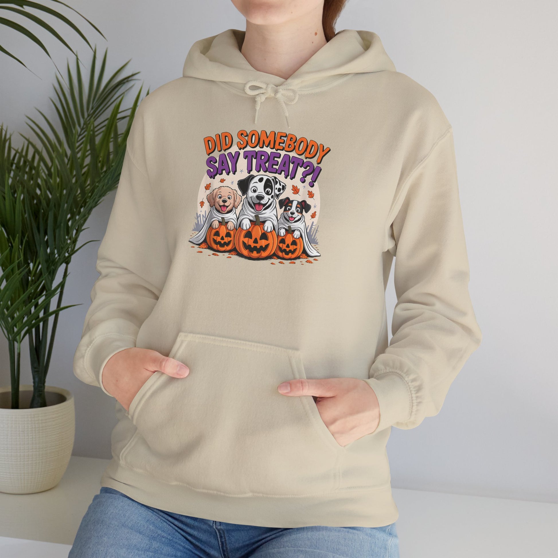 Printify beige hoodie featuring Halloween Dog Sweatshirt design with three dogs in ghost costumes and jack o lanterns