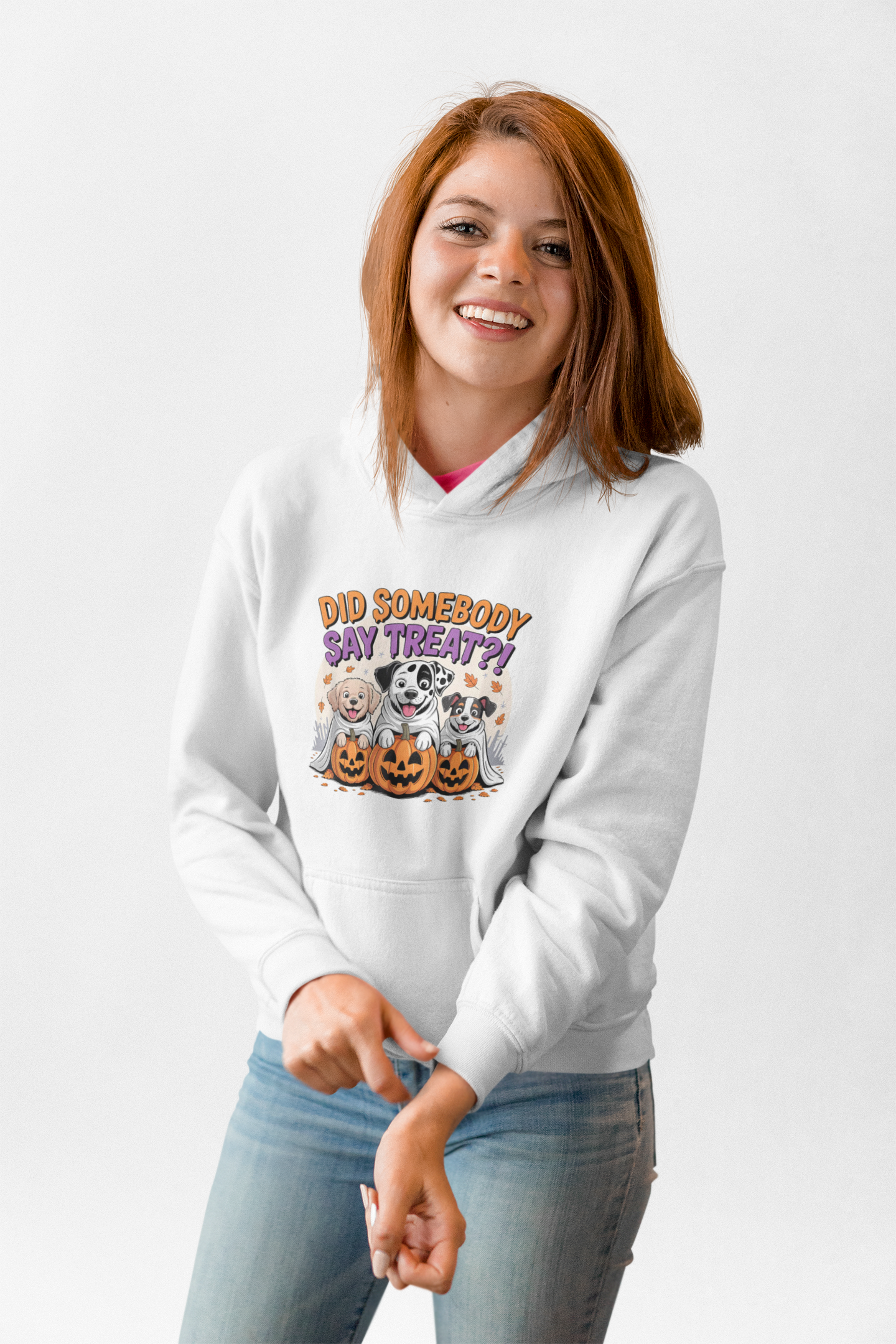 Printify white hoodie featuring Halloween Dog Sweatshirt graphic with three dogs in jack o lanterns and treat text