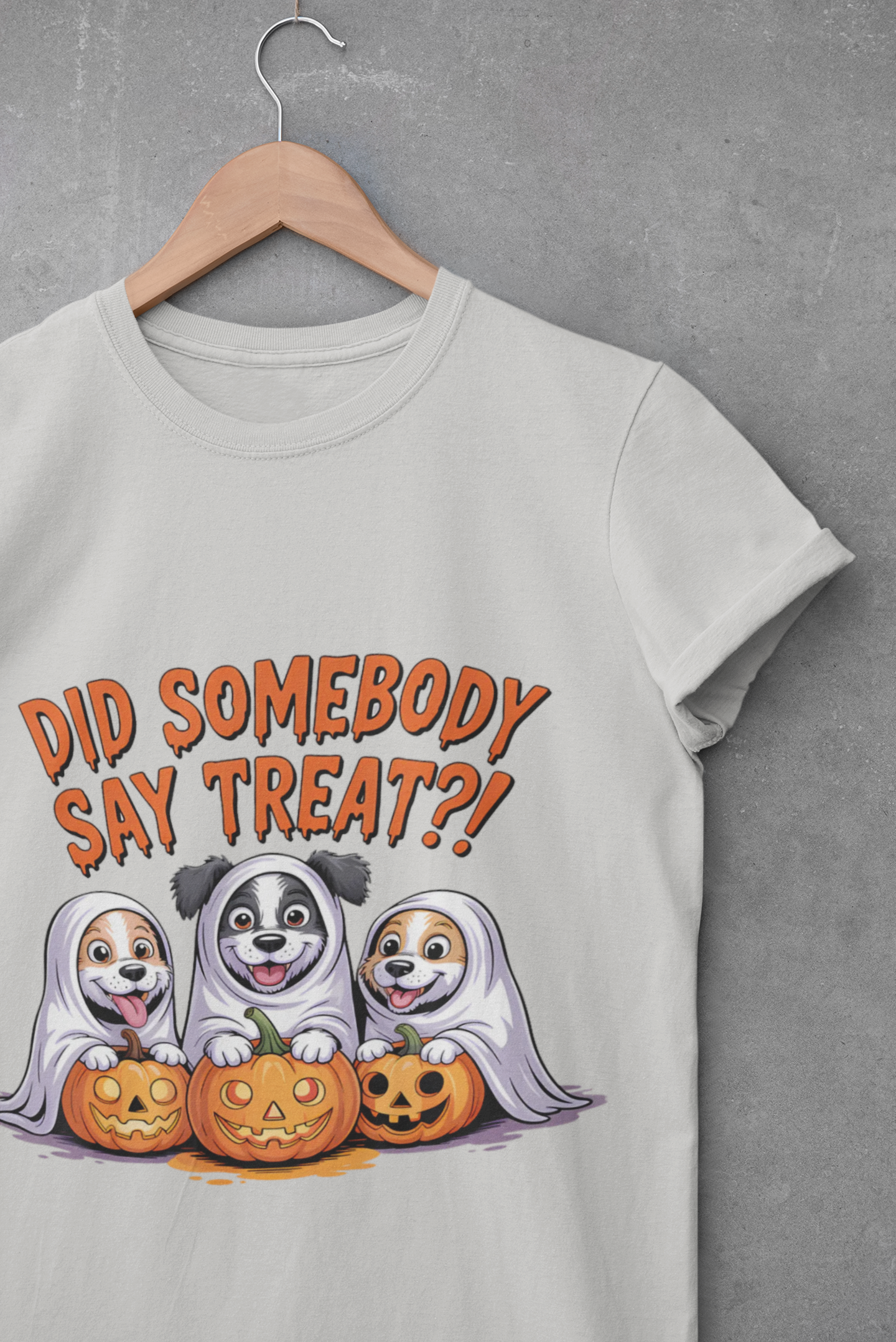 Spooky Halloween Dog Tee white shirt on hanger showing three dogs as ghosts with carved pumpkins
