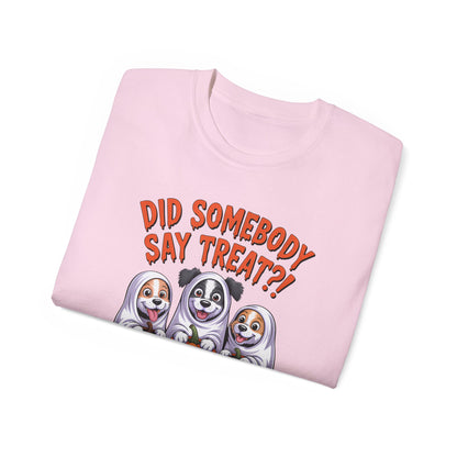 Spooky Halloween Dog Tee pink folded t shirt with three cartoon dogs in ghost costumes and treat text