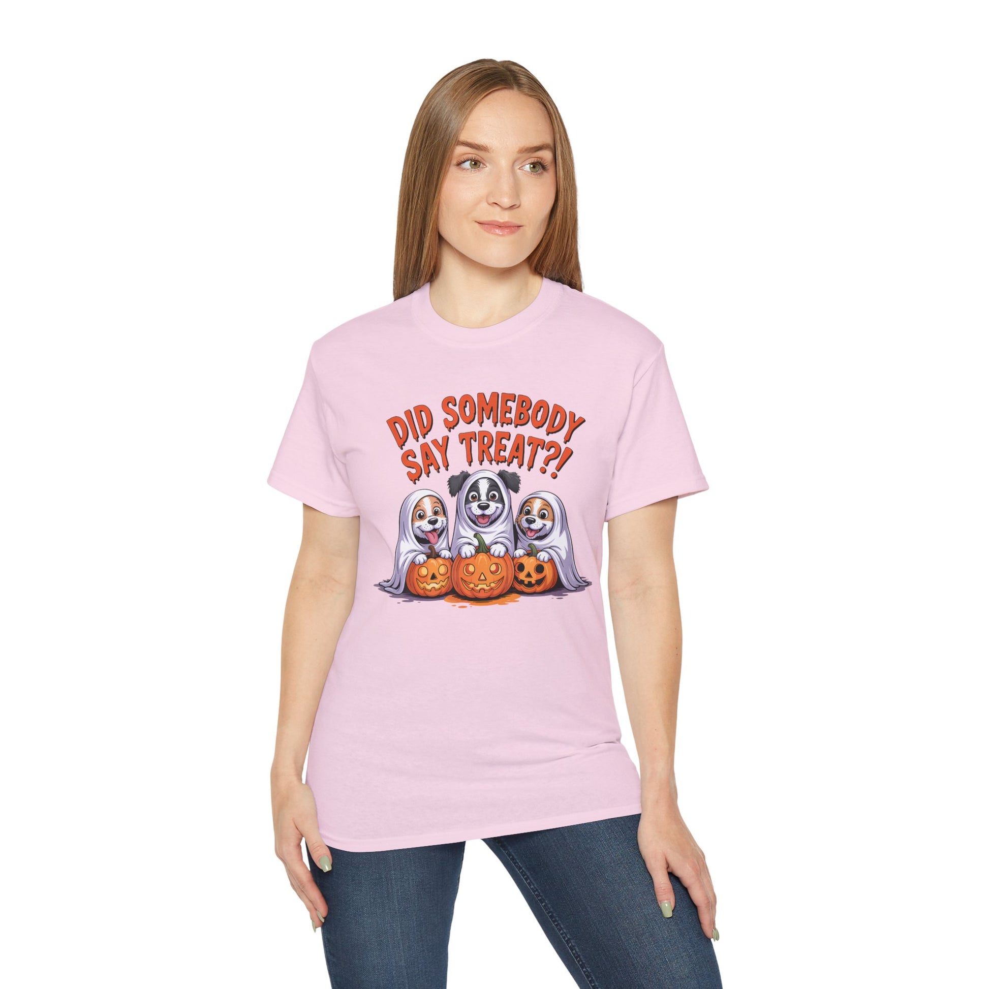 Spooky Halloween Dog Tee on a woman featuring three dogs in ghost costumes with jack o lanterns and treat text