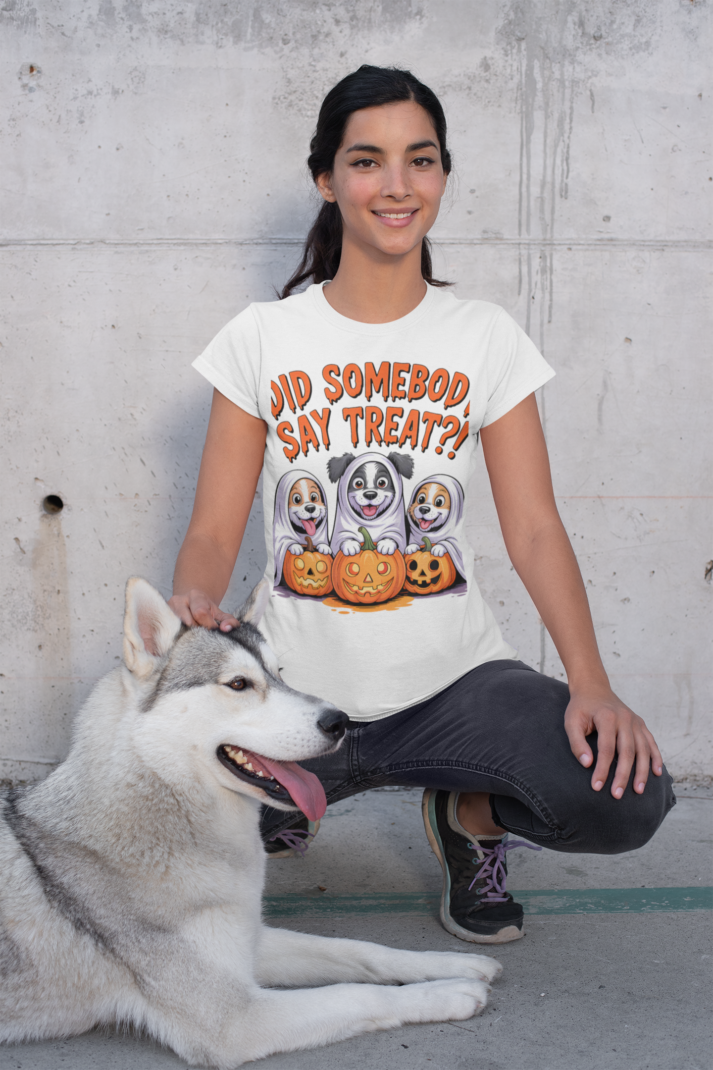 Spooky Halloween Dog Tee worn by smiling woman with husky and cartoon ghost dogs with pumpkins