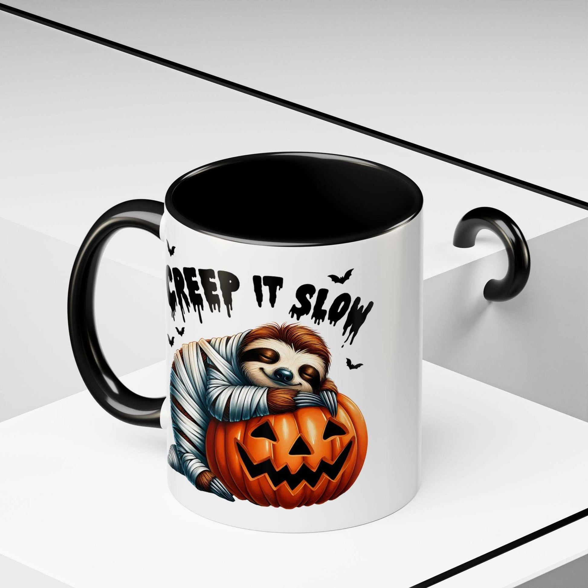 Printify Halloween Sloth Coffee Mug white ceramic with black handle and interior showing mummy sloth hugging jack o lantern