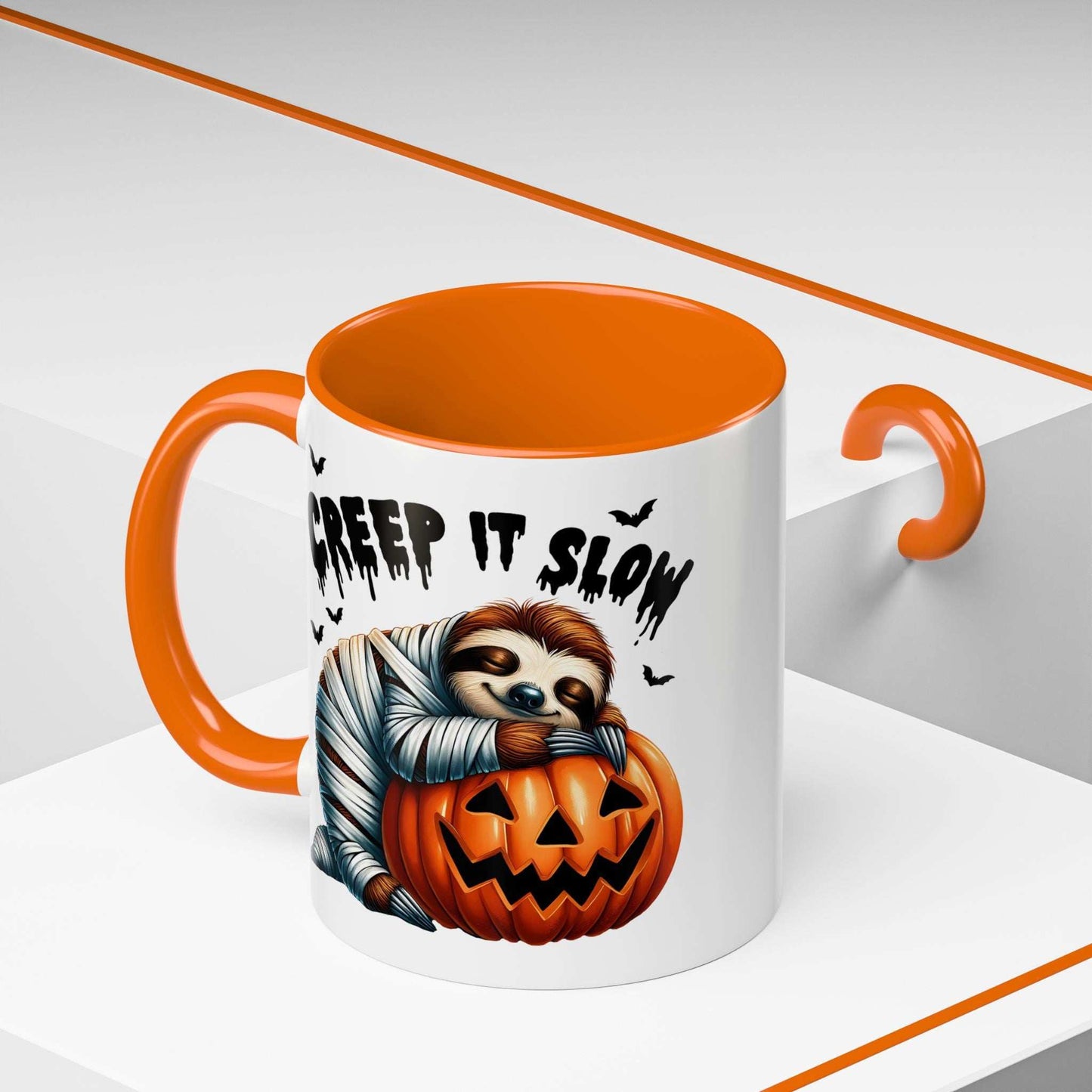 Halloween Sloth Coffee Mug with orange handle and interior featuring a mummy sloth hugging a carved pumpkin