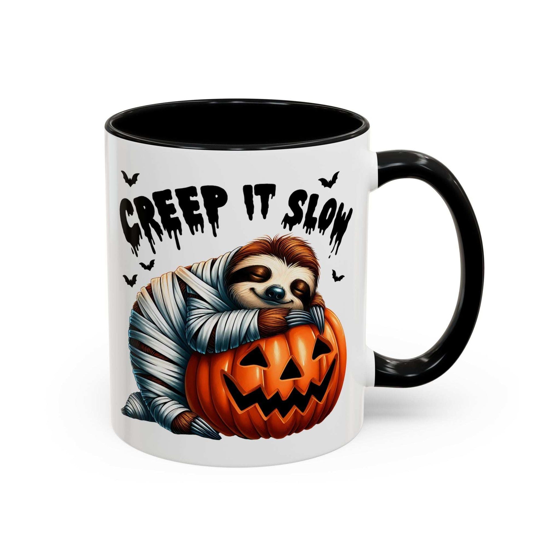 Halloween Sloth Coffee Mug showing a mummy sloth hugging a carved jack o lantern with bats and Creep It Slow text black handle