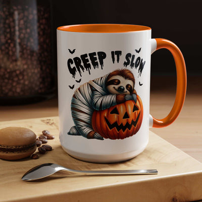 Halloween Sloth Coffee Mug white ceramic with orange handle and interior showing mummy sloth hugging jack o lantern