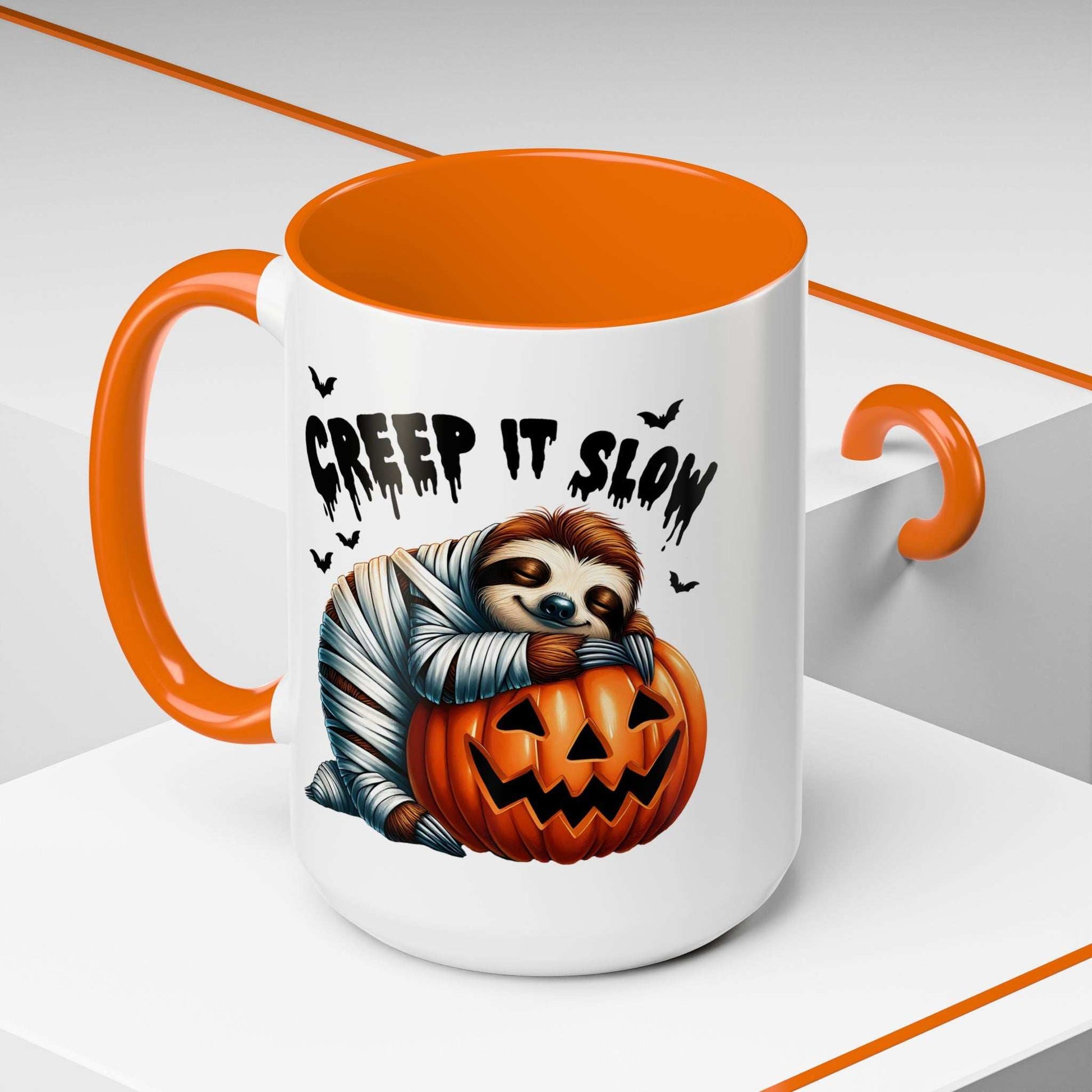 Halloween Sloth Coffee Mug with orange interior and handle showing sloth mummy hugging jack o lantern