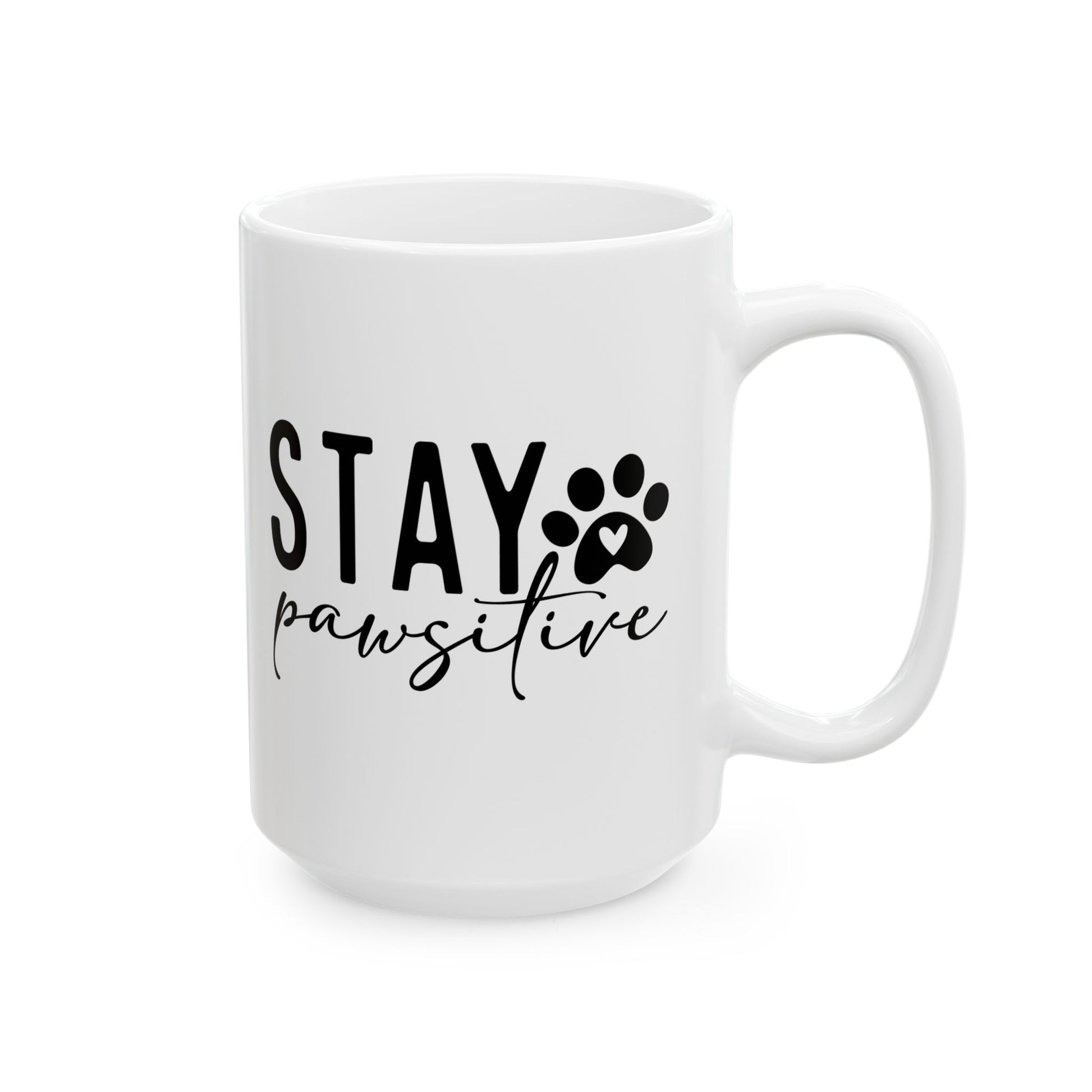 White ceramic Stay Pawsitive Mug with black text and paw print design from Printify