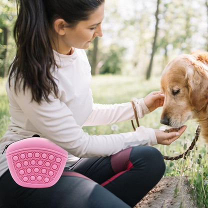 Wefulfil pink silicone treat pouch bag worn by woman training a golden retriever outdoors