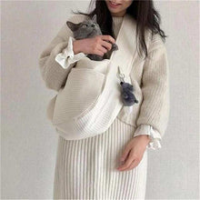 Wefulfil Cozy Pet Sling Carrier in white holding a gray cat with a plush keychain attached