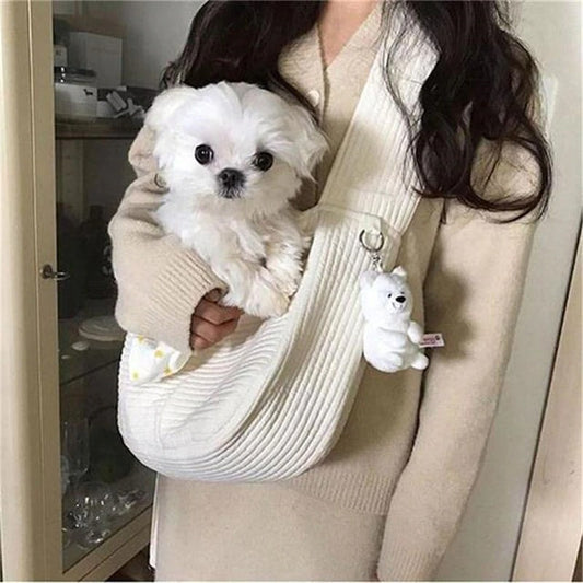 Wefulfil Cozy Pet Sling Carrier in cream color holding small white dog for hands-free pet carrying