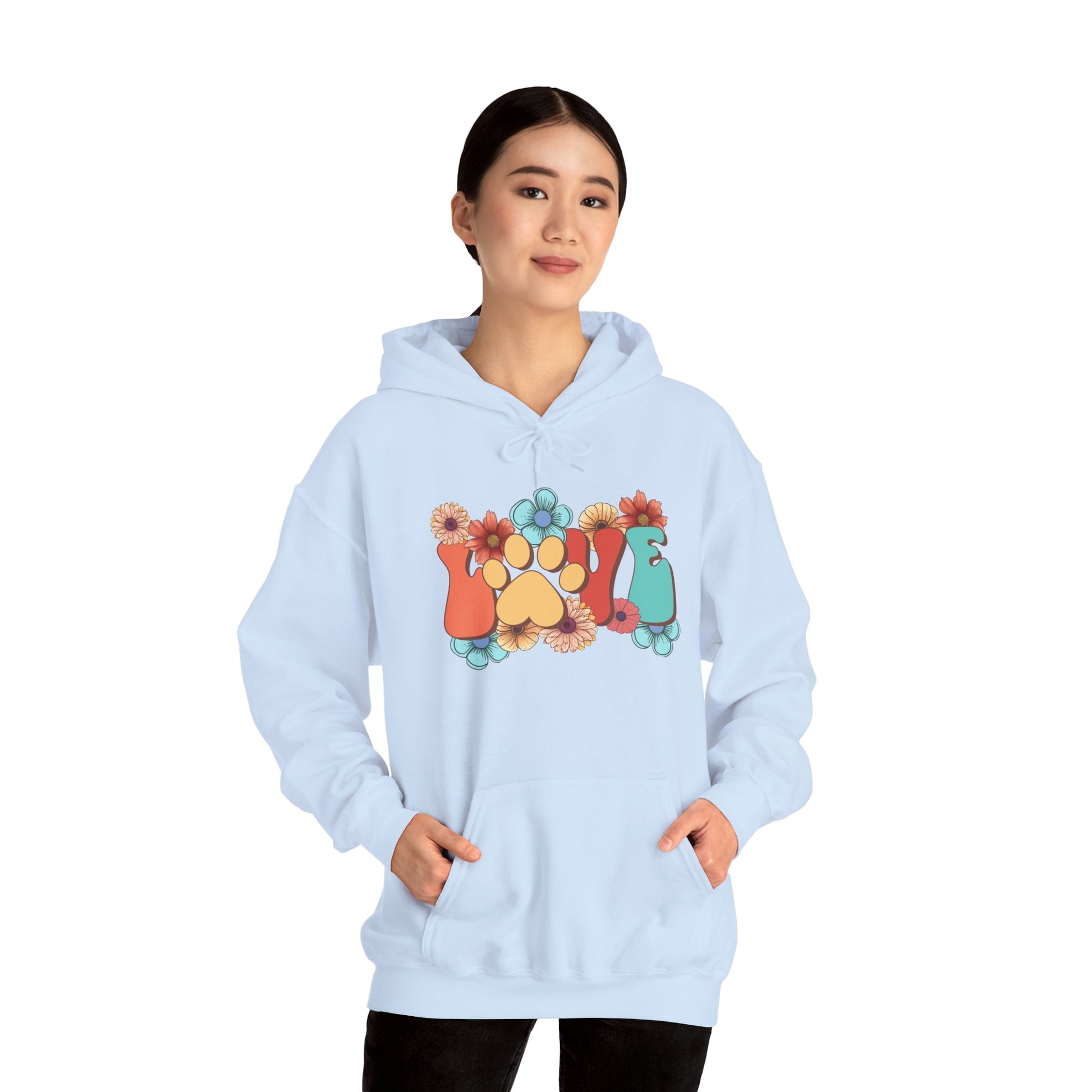 Animal Lover Hoodie Printify light blue oversized hoodie with floral paw print design worn by model