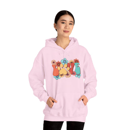 Printify light pink Animal Lover Hoodie worn by woman featuring colorful paw print and floral graphic