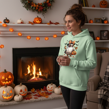 Woman by fireplace wearing ghost hoodie